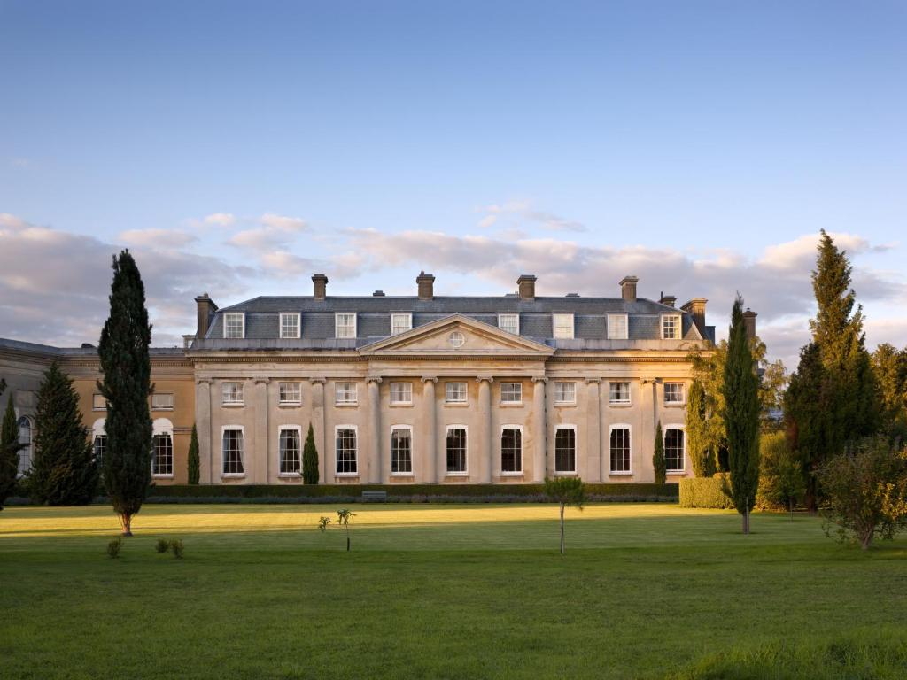 a large white house with a large lawn at The Ickworth Hotel And Apartments - A Luxury Family Hotel in Bury Saint Edmunds