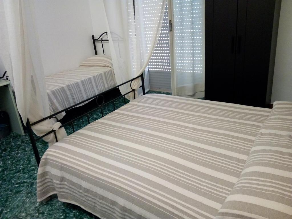 A bed or beds in a room at Porta Nuova