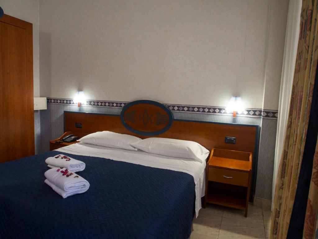 Postel nebo postele na pokoji v ubytování Hotel Kroma