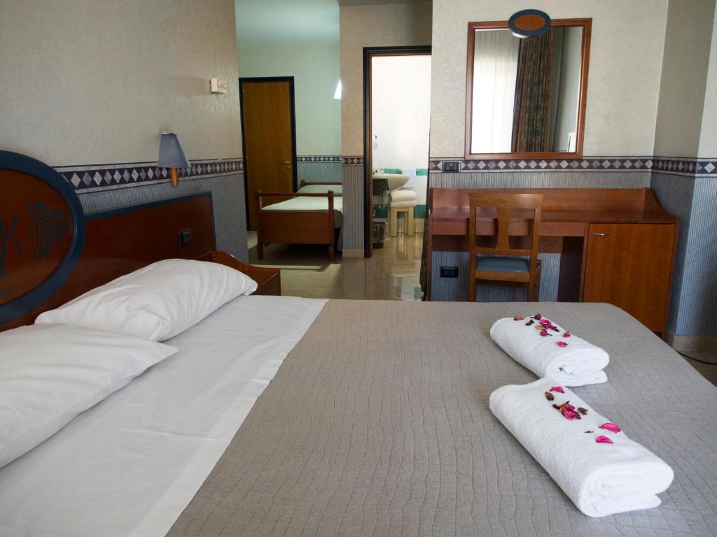 Postel nebo postele na pokoji v ubytování Hotel Kroma