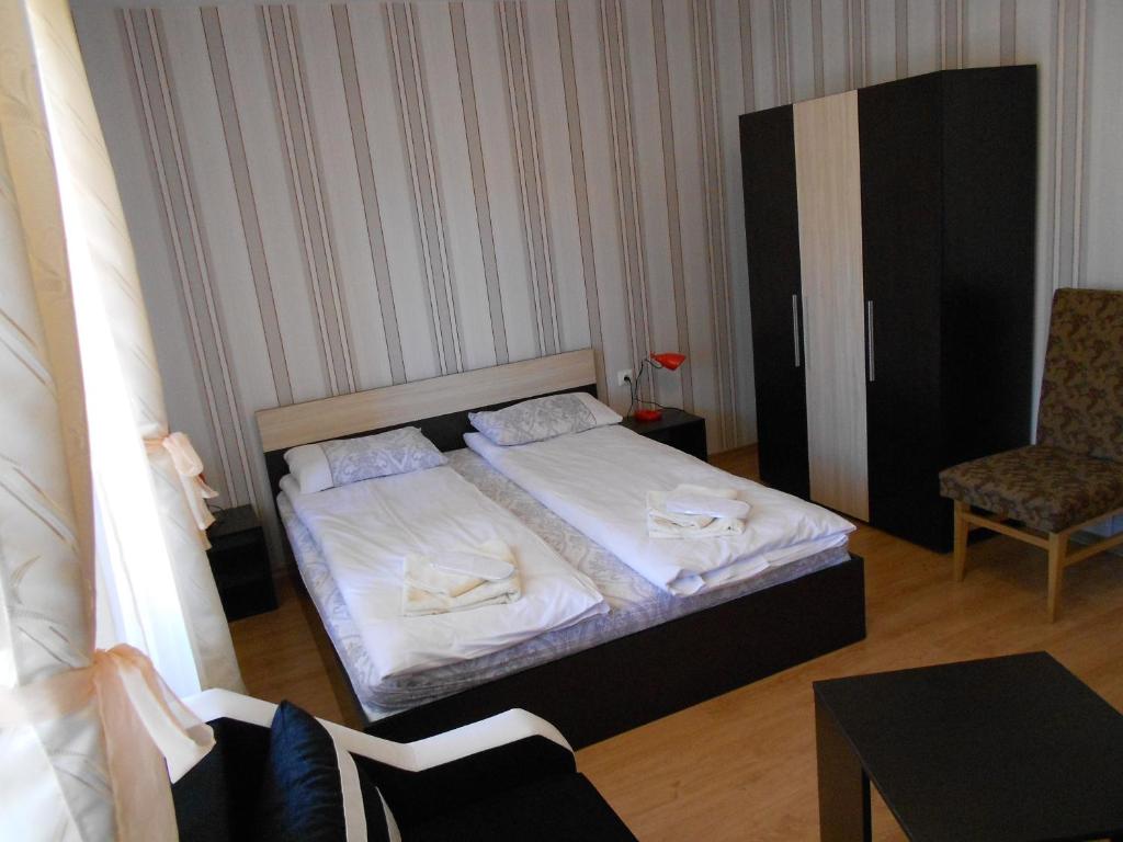 Postel nebo postele na pokoji v ubytování Guest House Tsenovi