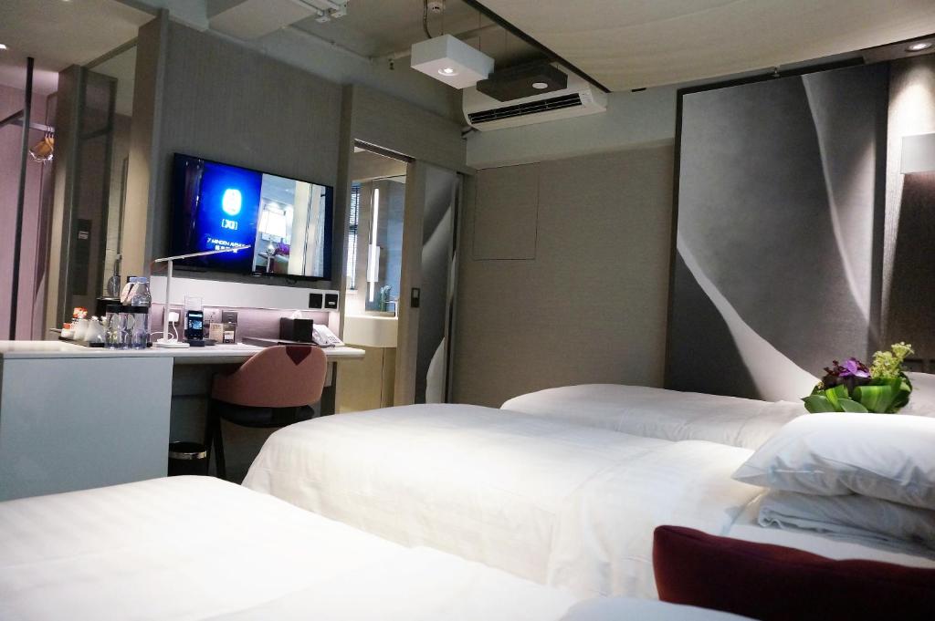 Letto o letti in una camera di Xi Hotel
