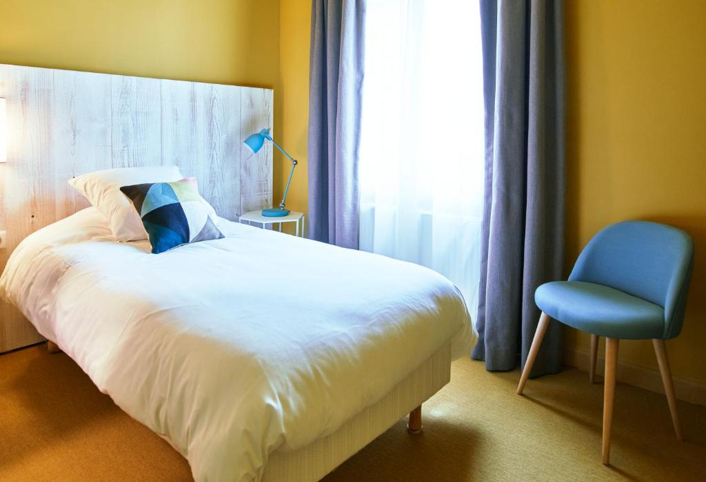 Postel nebo postele na pokoji v ubytování Le Central Boutique Hôtel