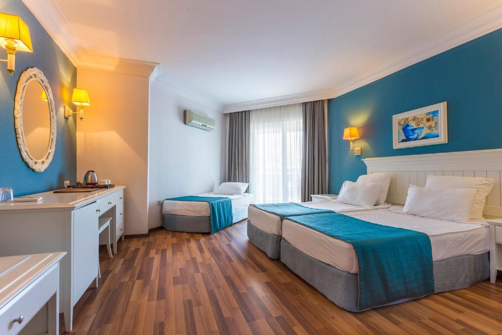 Postel nebo postele na pokoji v ubytování Hotel Terrace Beach Resort All Inclusive