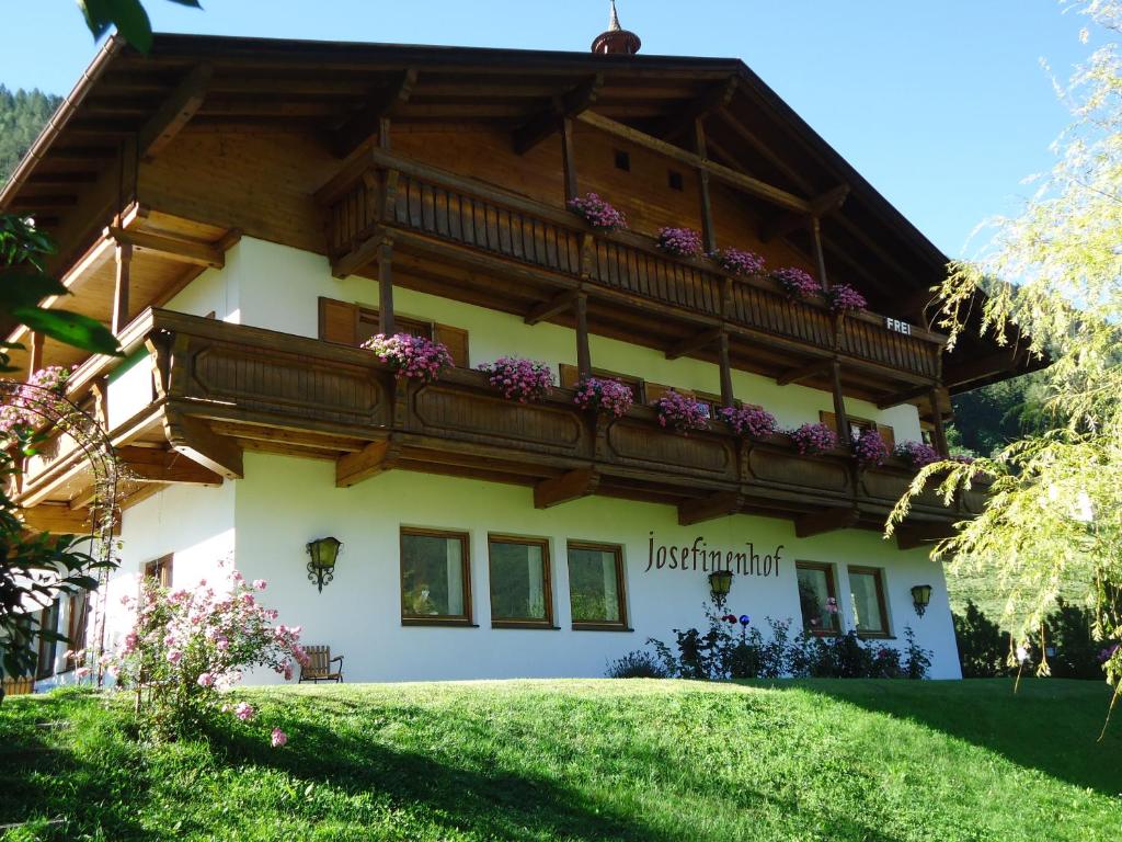 a house with a balcony on top of it at Josefinenhof in Neustift im Stubaital