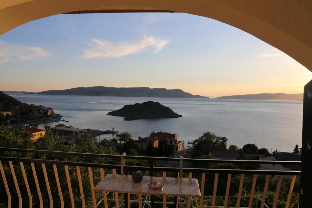 a view of the ocean from a balcony at Rooms Marica in Sveti Juraj