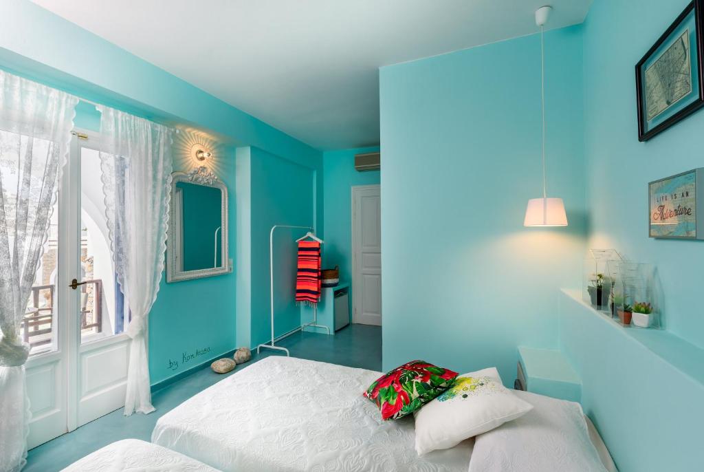 Postel nebo postele na pokoji v ubytování Ios Resort