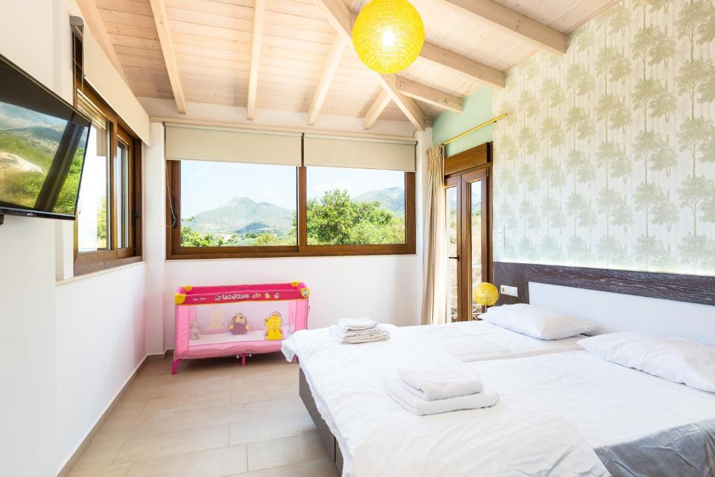 Łóżko lub łóżka w pokoju w obiekcie Kampos Villas, pure elegance, By ThinkVilla
