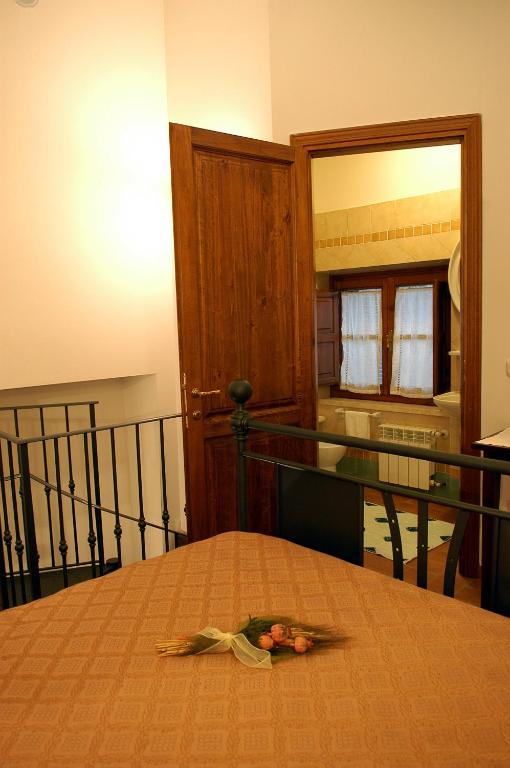 Postel nebo postele na pokoji v ubytování Poderone Vecchio