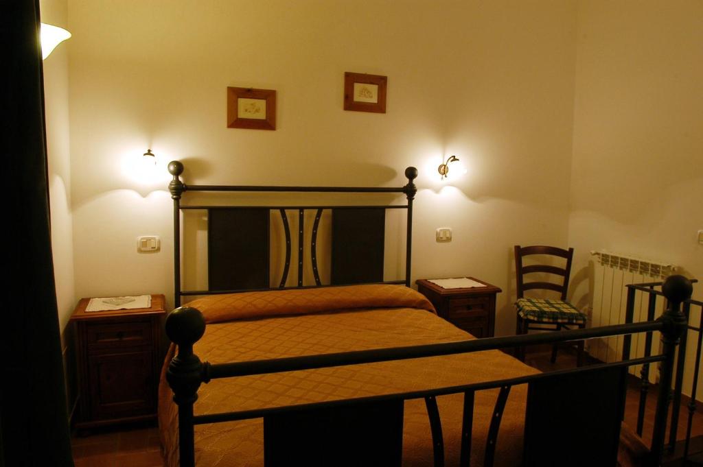 Postel nebo postele na pokoji v ubytování Poderone Vecchio