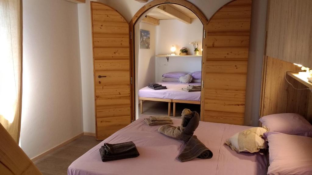Postel nebo postele na pokoji v ubytování CastelCharme b&b