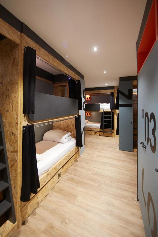 Postel nebo postele na pokoji v ubytování Moontain Hostel