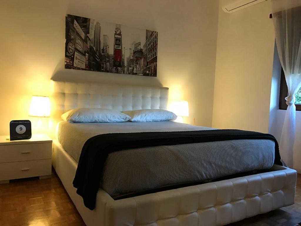 Posteľ alebo postele v izbe v ubytovaní Princess B&B Frascati