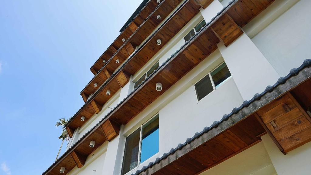 a wooden roof on a house at Xiu Shui Hotel in Yuchi