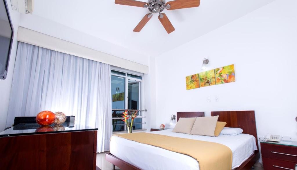Postel nebo postele na pokoji v ubytování Atlantis Plaza Hotel Cúcuta