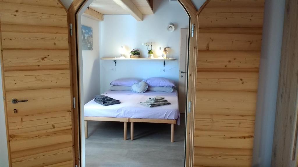 Postel nebo postele na pokoji v ubytování CastelCharme b&b