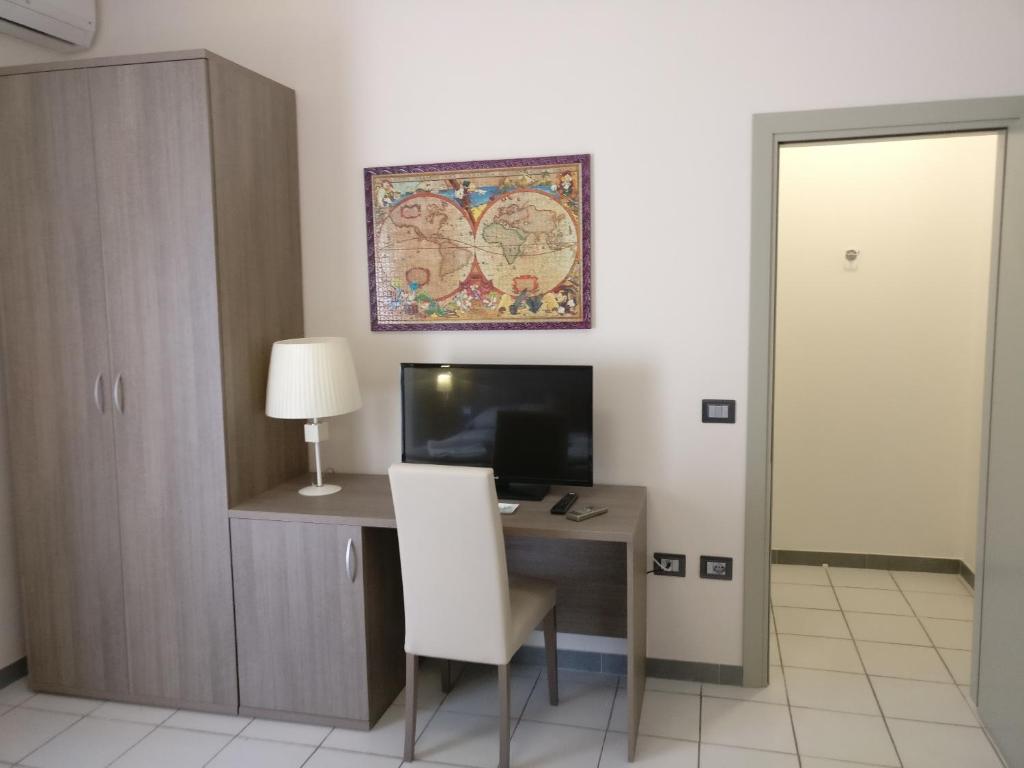 TV a/nebo společenská místnost v ubytování Hotel I Pini