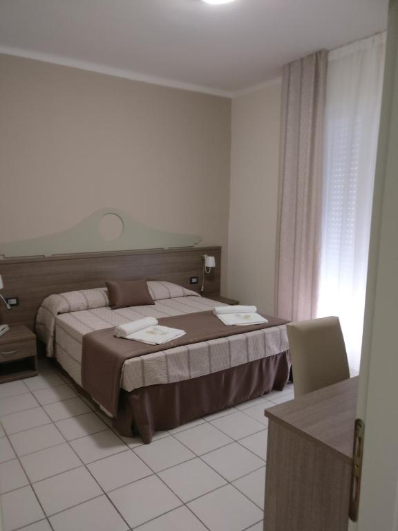 Postel nebo postele na pokoji v ubytování Hotel I Pini