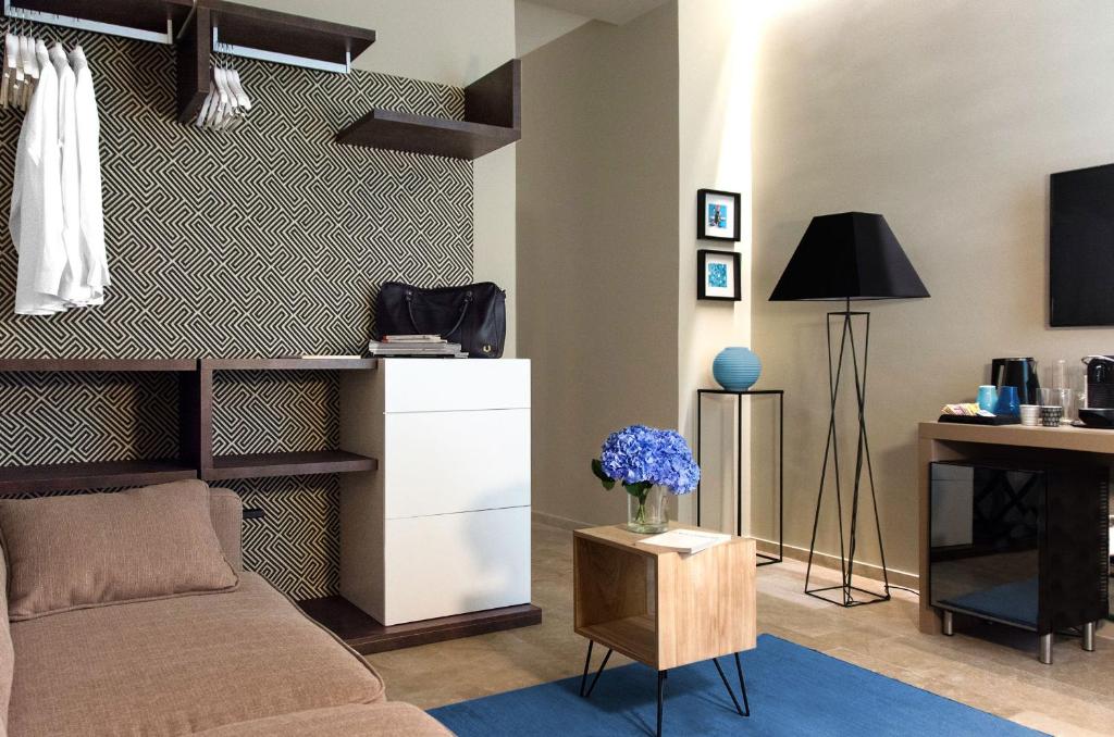 TV a/nebo společenská místnost v ubytování CinqueSuites Ortigia