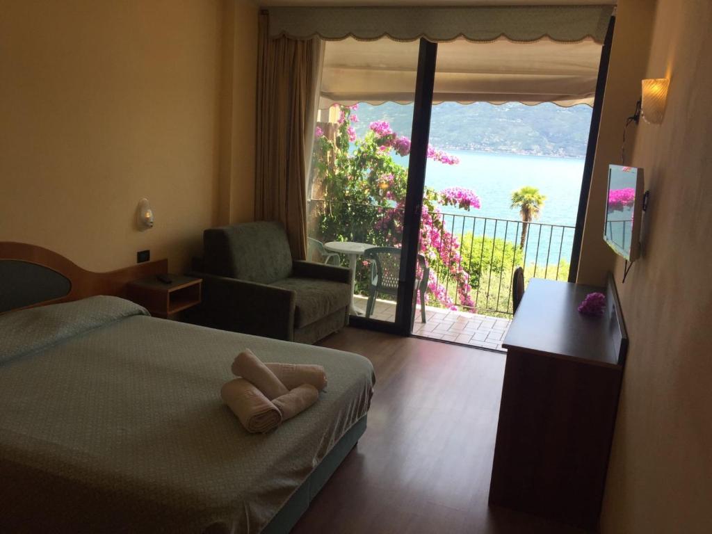 Postel nebo postele na pokoji v ubytování Hotel Lido