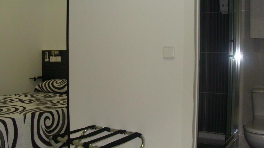 Postel nebo postele na pokoji v ubytování Hostal JQ Madrid 1