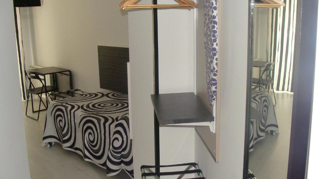 Postel nebo postele na pokoji v ubytování Hostal JQ Madrid 1