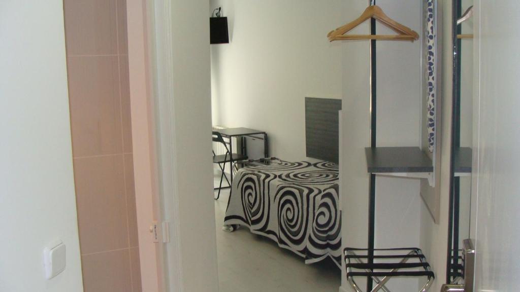 Postel nebo postele na pokoji v ubytování Hostal JQ Madrid 1