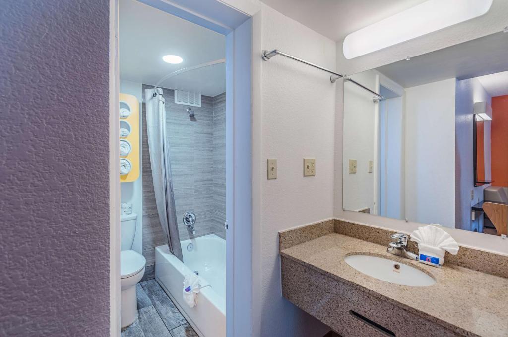 a bathroom with a sink and a toilet and a shower at Motel6 Winchester, VA in Winchester