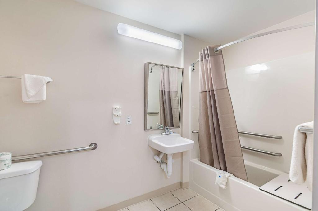 a bathroom with a sink and a toilet and a shower at Motel6 Winchester, VA in Winchester