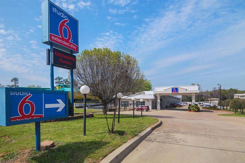 a sign in front of a gas station at Studio 6-Tyler, TX in Tyler