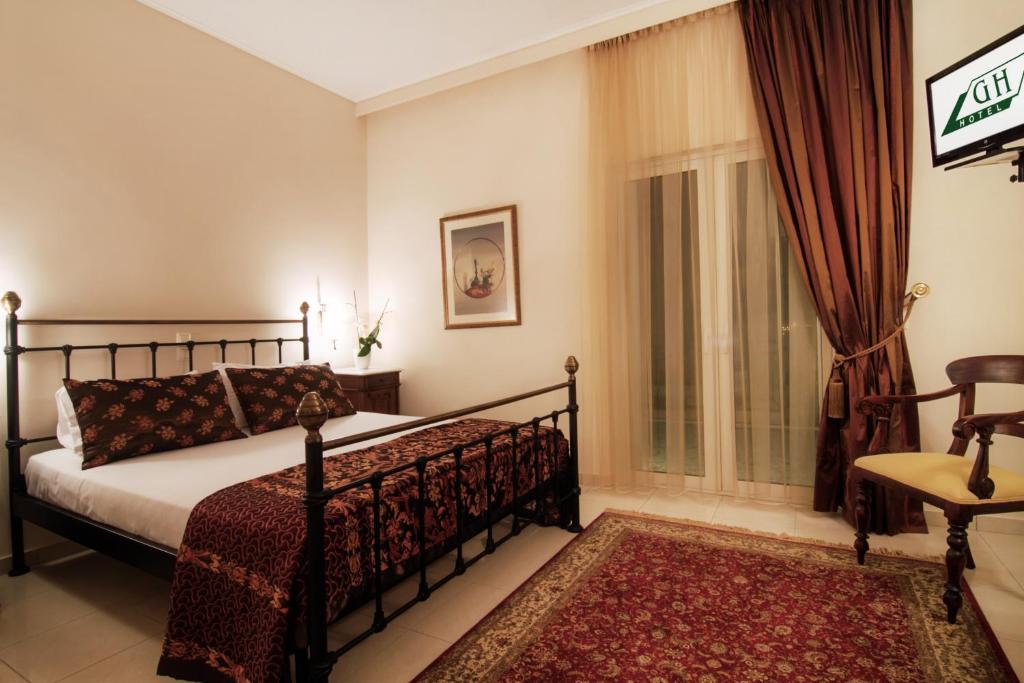 Postel nebo postele na pokoji v ubytování Green Hill Hotel