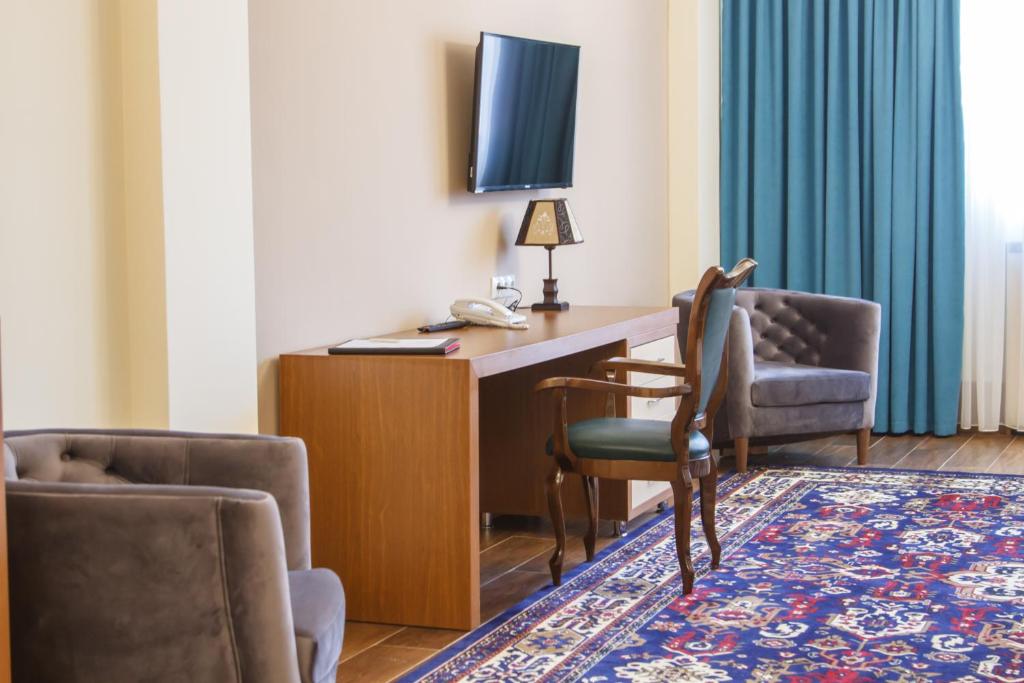 TV a/nebo společenská místnost v ubytování Hotel Plaza Viktoria