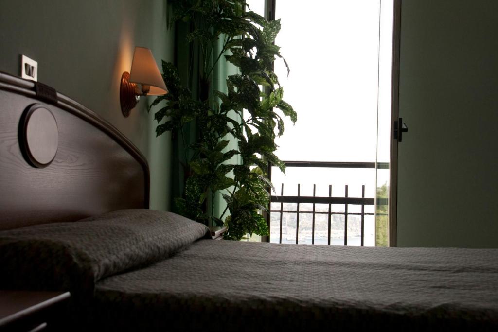 Postel nebo postele na pokoji v ubytování Hotel Eden