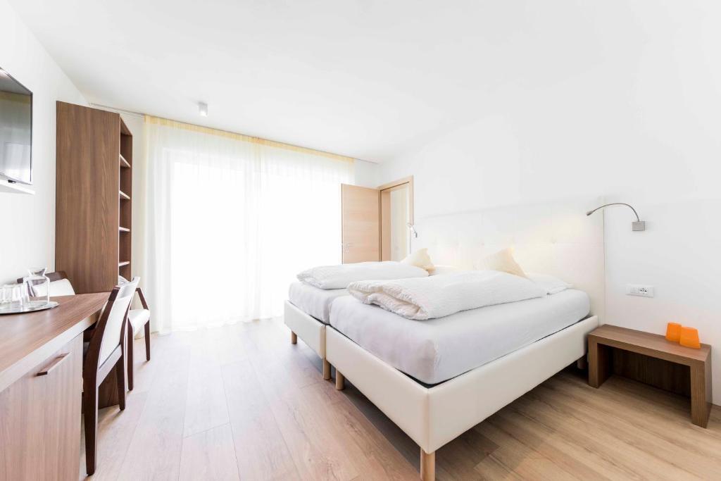 Postel nebo postele na pokoji v ubytování Hotel Markushof - Adults only
