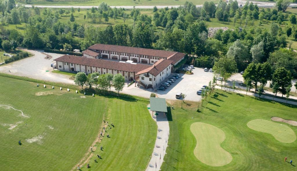 an aerial view of a building with a golf green at Hotel Ultimo Borgo in Settimo Torinese