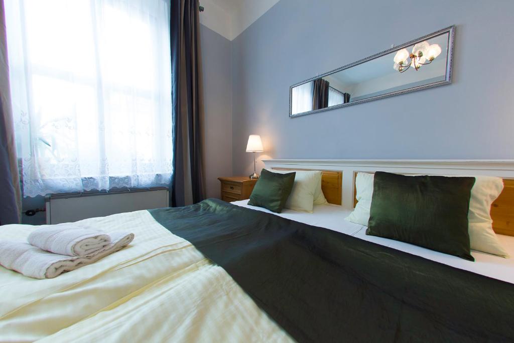 Postel nebo postele na pokoji v ubytování Hotel Soudek