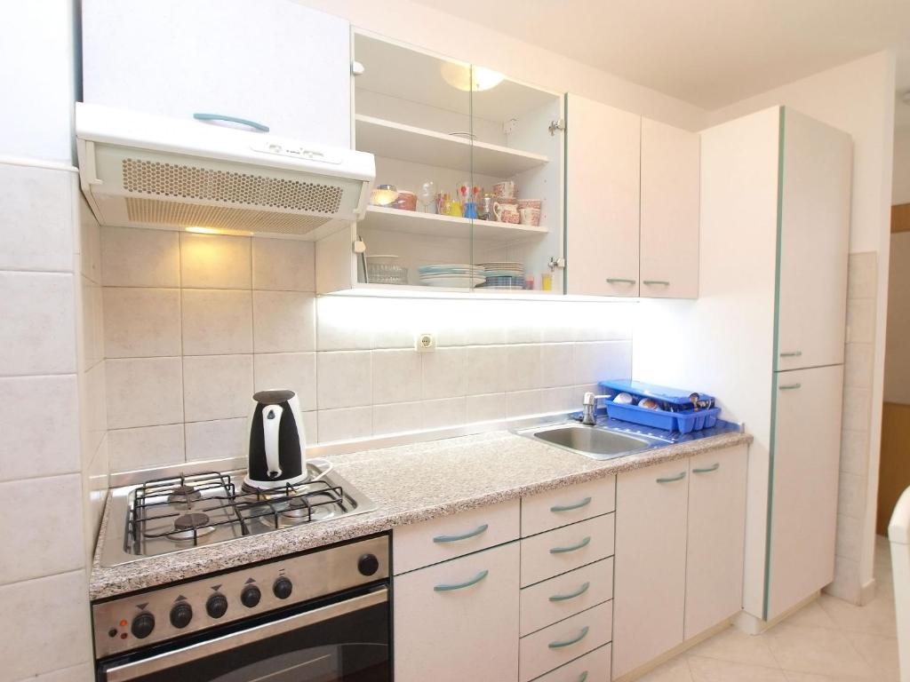 Kuchyň nebo kuchyňský kout v ubytování Apartments Milan 1457
