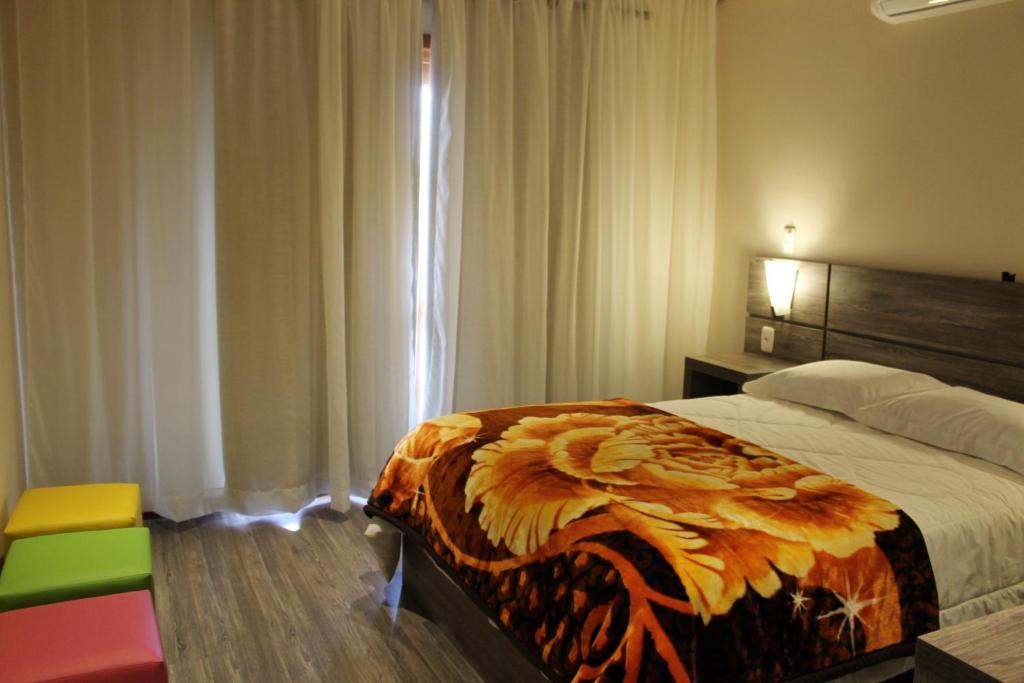 Postel nebo postele na pokoji v ubytování Residencial Aconchego do Lago
