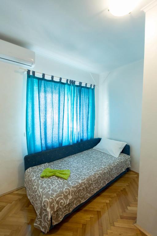 Postel nebo postele na pokoji v ubytování Apartmani Amaro