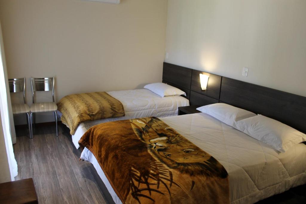 Postel nebo postele na pokoji v ubytování Residencial Aconchego do Lago
