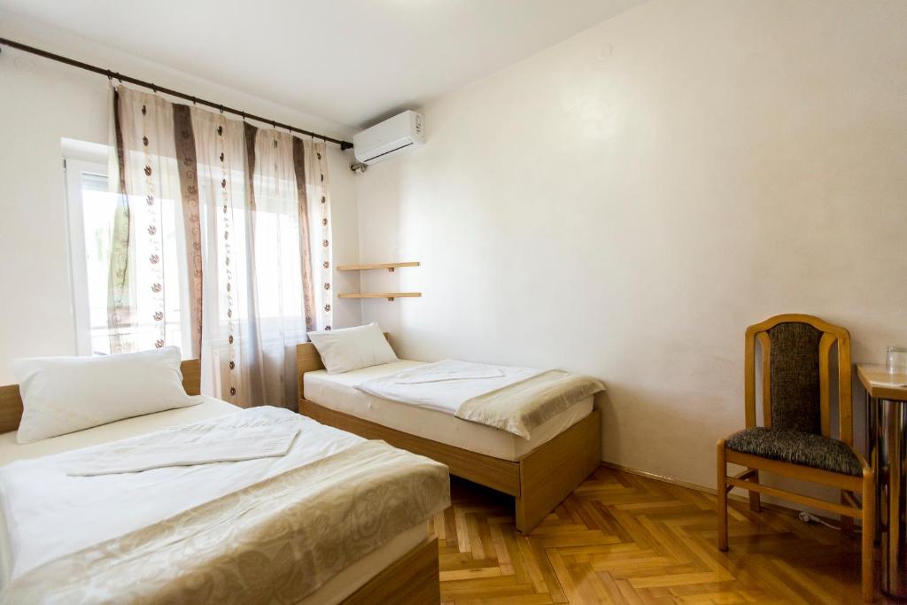 Postel nebo postele na pokoji v ubytování Apartmani Amaro