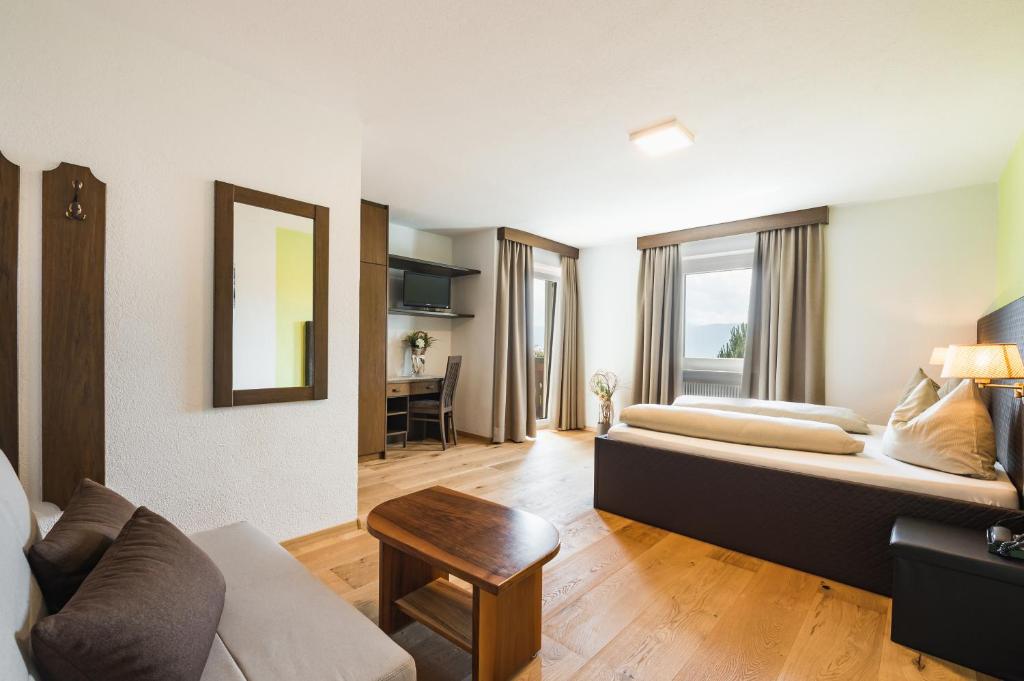 Łóżko lub łóżka w pokoju w obiekcie Hotel Restaurant Alber