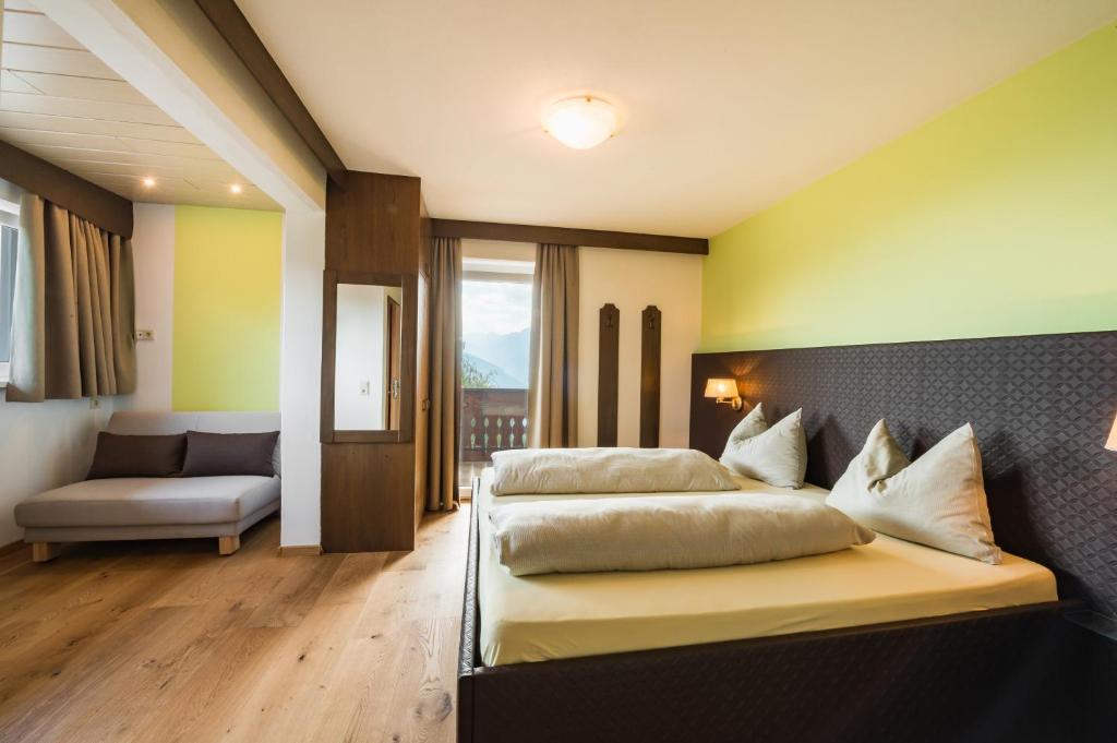 Łóżko lub łóżka w pokoju w obiekcie Hotel Restaurant Alber