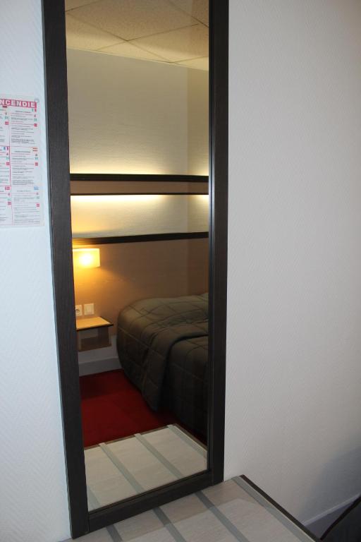 Postel nebo postele na pokoji v ubytování Hôtel de la Meuse