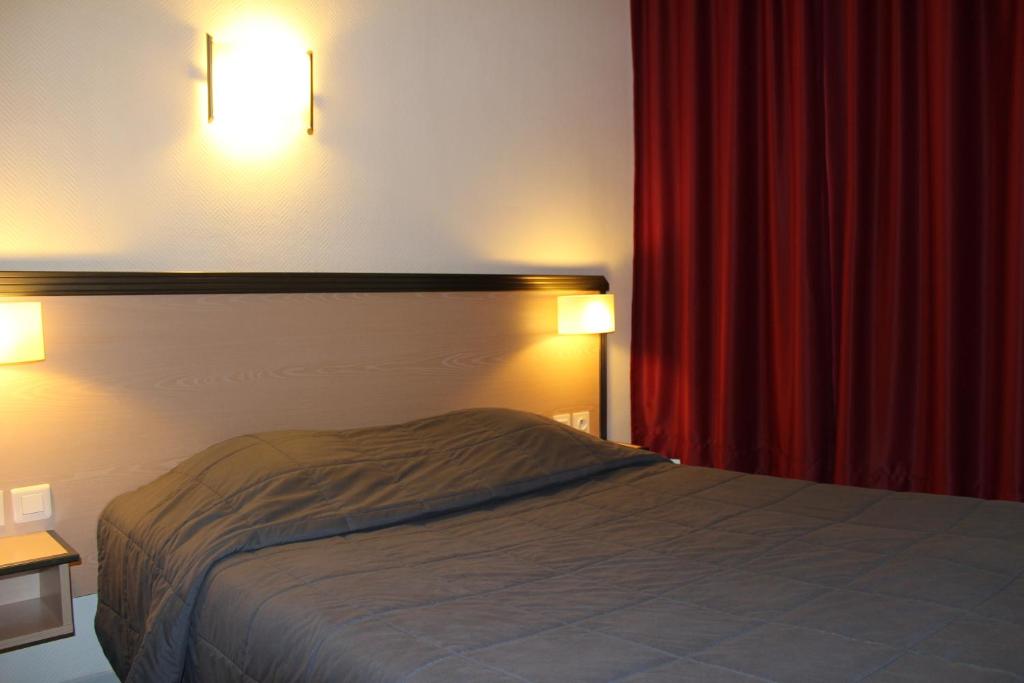 Postel nebo postele na pokoji v ubytování Hôtel de la Meuse