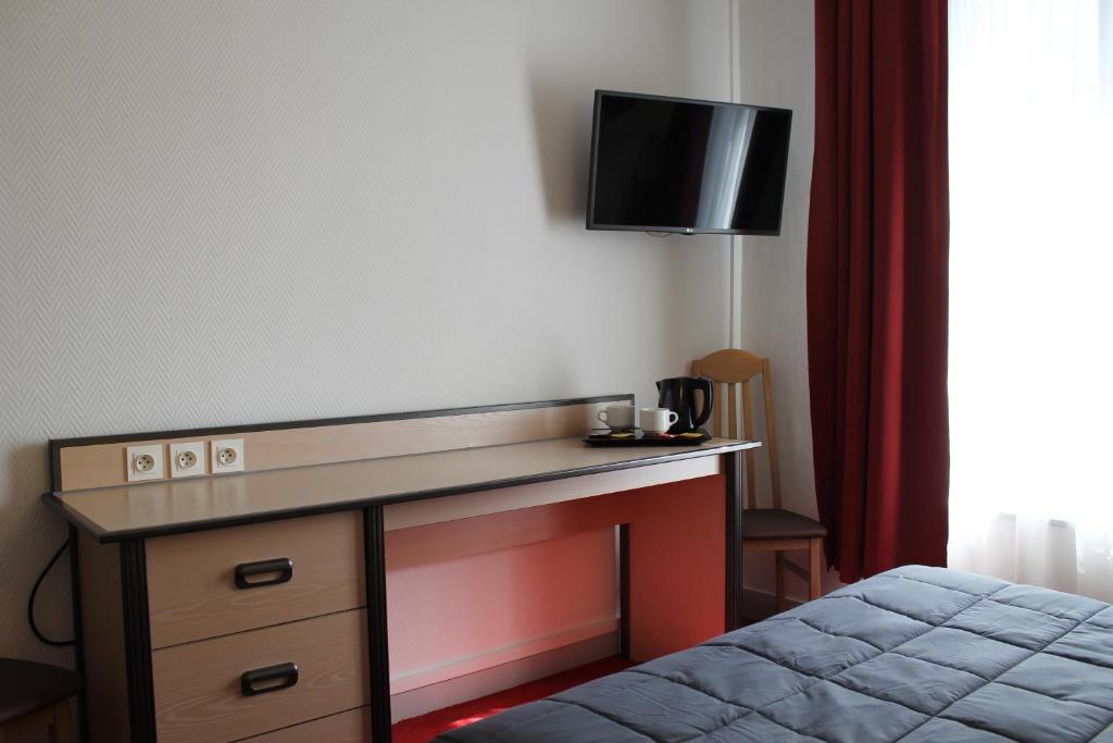 Postel nebo postele na pokoji v ubytování Hôtel de la Meuse