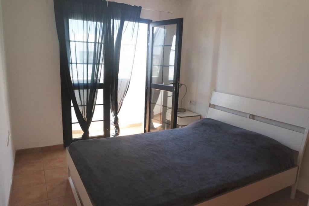 Postel nebo postele na pokoji v ubytování La Fresa Hostel