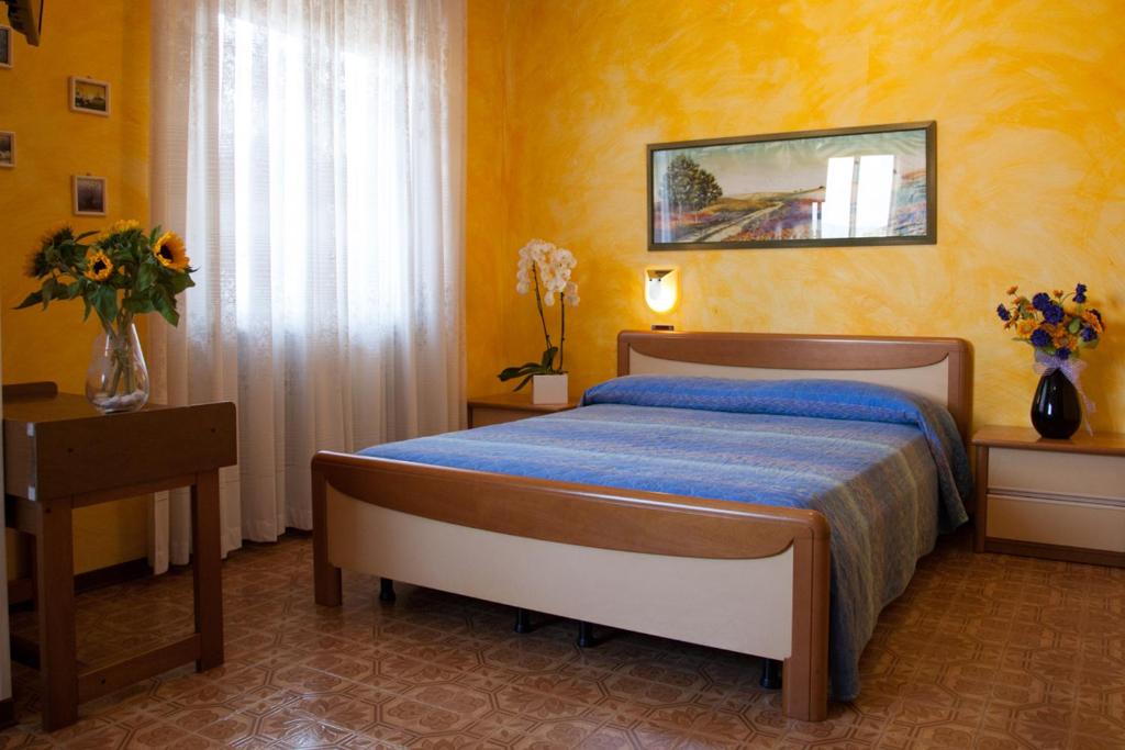 Postel nebo postele na pokoji v ubytování Hotel STELLA D'ORO