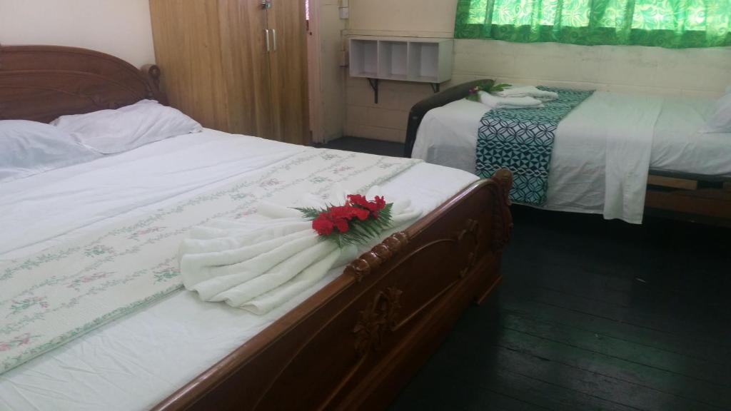 Postel nebo postele na pokoji v ubytování Samoa Home