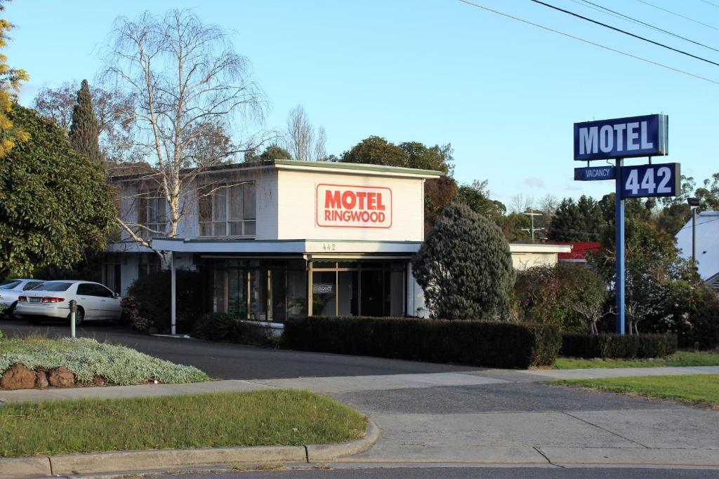 a motel involved sign in front of a building at Motel Ringwood in Ringwood